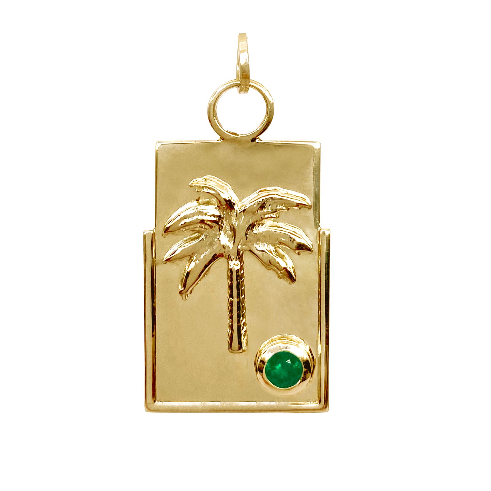 gold medallion with colombian emerald and a palm tree mystical intentional jewelry