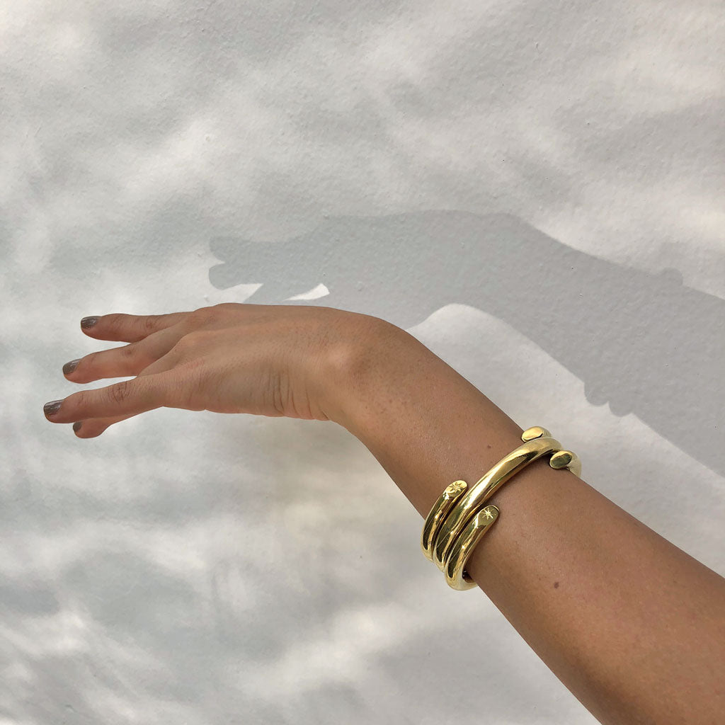 golden bracelets stack minimal handmade jewelry ana buendia latinamerican designer