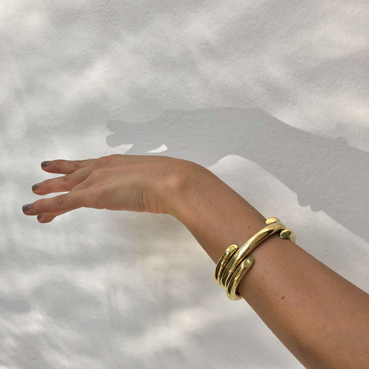 golden bracelets stack minimal handmade jewelry ana buendia latinamerican designer